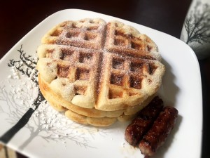 Maple Sausage with Stuffed Waffles sprinkled with powdered sugar