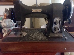 Value of a Vintage White Rotary Sewing Machine - old black machine in a wooden base