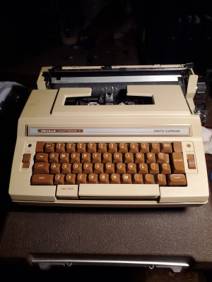 Repairing a Smith Corona Deville Electric Typewriter - tan typewriter