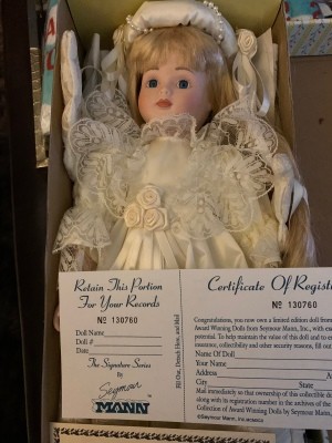 Value of Seymour Mann Dolls - doll wearing a white (possible bridal dress) in box with the certificate