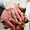The hands of a newlywed couple.