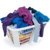 A white laundry basket full of clothing.