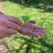 A man applying hand sanitizer to his bare hands.