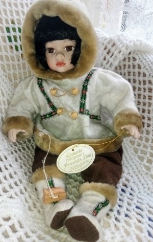 Value of a Leonardo Collection Doll - indigenous doll wearing a parka with faux fur trim and mukluks