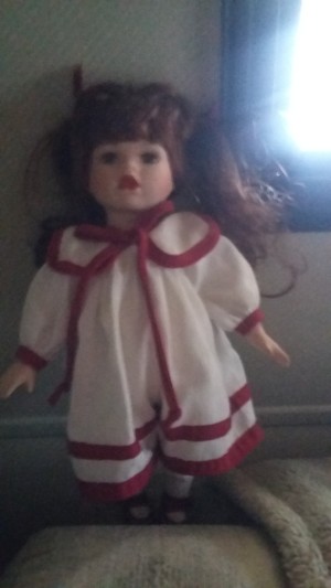 Value of a Collector's Choice Doll - doll in white dress with red trim