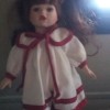 Value of a Collector's Choice Doll - doll in white dress with red trim