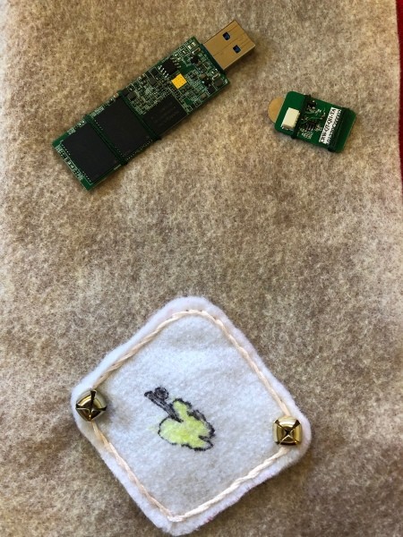 Child's Felt Book - bells sewn to two corners of the power supply
