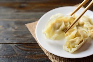 A plate of potstickers.