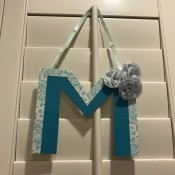 Hanging Initial Letter Decor - finished letter hanging on plantation blinds