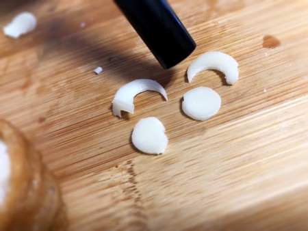 Making Animal Shaped Sushi - making paws from string cheese using a straw to cut the circle from a thin slice of cheese