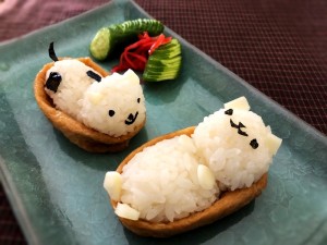 Making Animal Shaped Sushi - pickled ginger and cucumber slices garnish next to the finished sushi