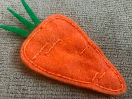Felt Carrot Garland and Paper Carrot Sign - closeup of stitched details on carrot