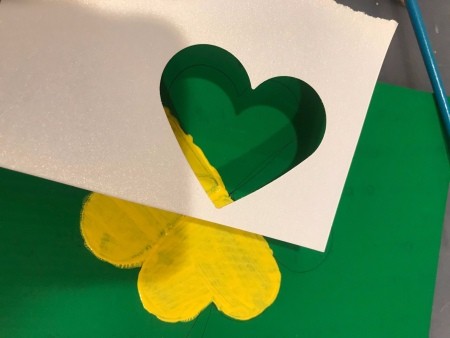 St. Patrick's Day Theme Hanging Wall Sign - painting the clover yellow