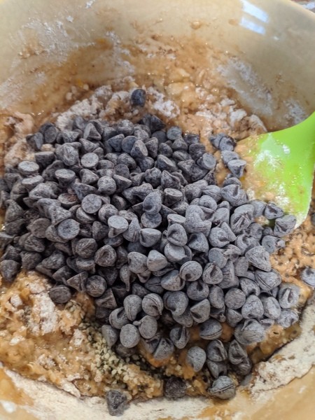 adding chocolate chips to batter