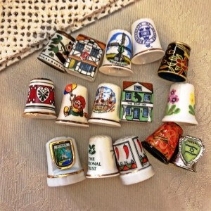 Value of Collectible Thimbles - variety of thimbles, including two that are house shaped