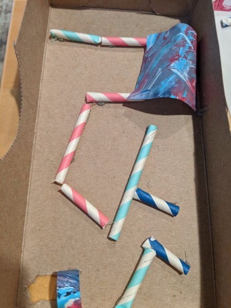 DIY Tissue Box Marble Maze - cut scrap paper or artwork to create tunnels and glue in place