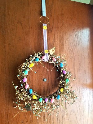 Repurposed Easter Wreath - finished wreath hanging on a door