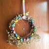 Repurposed Easter Wreath - finished wreath hanging on a door