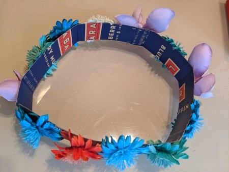 Making a Flower Crown - flowers glued around the outside of the crown