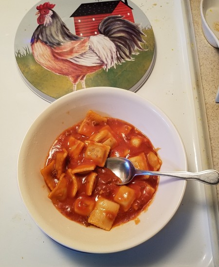 A bowl of pasta in tomato sauce.