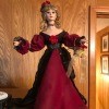 Identifying and Value of a Porcelain Doll - doll wearing a long dark red gown