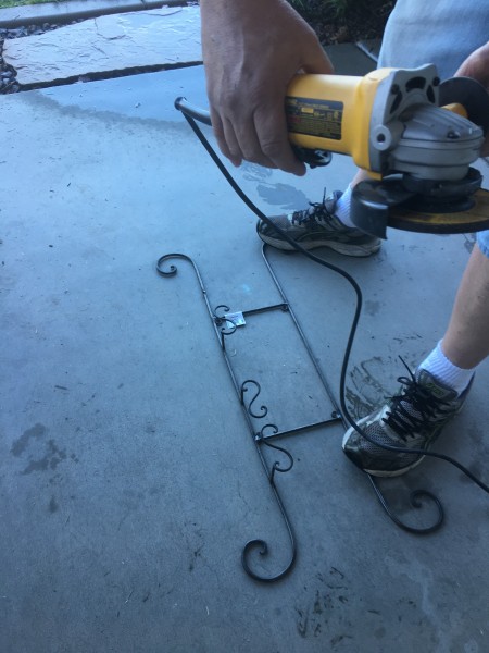 Re-Cycle Planter - person holding a sander