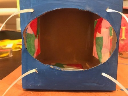 Kids DIY Cardboard Lantern - cut 2 lengths of ribbon and thread through the holes