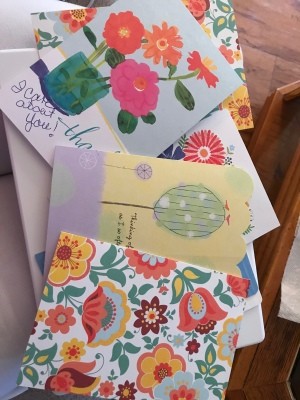 Cheerful greeting cards in a pile.