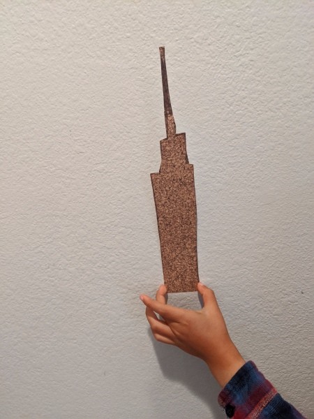 Cityscape Background for Playing with Toys - skyscraper reminiscent of the Empire State Building