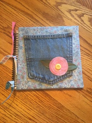 Making a Journal with a Jeans Pocketl - finished bound journal with ribbons tied to spiral binding