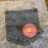 Making a Journal with a Jeans Pocket - pocket with dryer sheet flower sewn to front piece of fabric