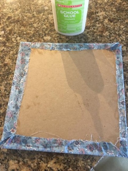 Making a Journal with a Jeans Pocket - glue fabric to chipboard, folding in the edges