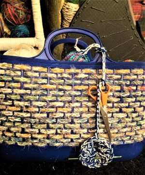 Crochet Buddy for Hook and Needle - crochet buddy tied to handle of craft basket