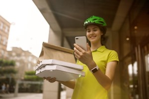A bike courier delivering a food order.