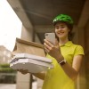 A bike courier delivering a food order.