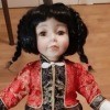 Identifying a Porcelain Doll - doll wearing Asian attire, pants and jacket with frog closure