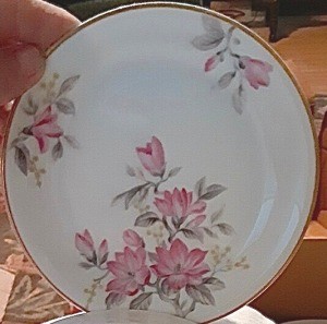 Determining the Value of Noritake China - gold trimmed white plate with three clusters of pink flowers