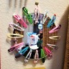 Fun Mirror with Barrettes - mirror hanging on the wall