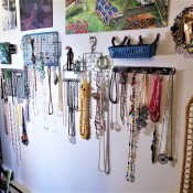 Hanging Necklaces Using Re-purposed Item - wall covered in hanging necklaces and other crafts