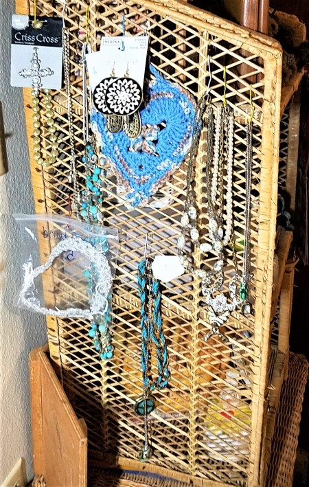 Hanging Necklaces Using Re-purposed Items - additional hanging area on wicker bookcase
