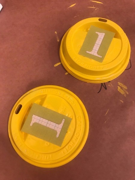 Kids' Award Medals - scrapbook paper with the number 1 cut and glued to the top of the lids once paint dried