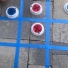 Outdoor Tic Tac Toe Game - tic tac game board made with painter's tape on patio