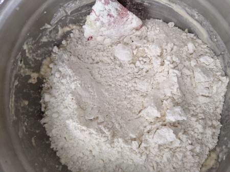 adding flour to Pizza Dough