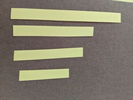 Chick or Duckling Easter Decoration - lengths of yellow paper leftover from cutting the pieces for the body