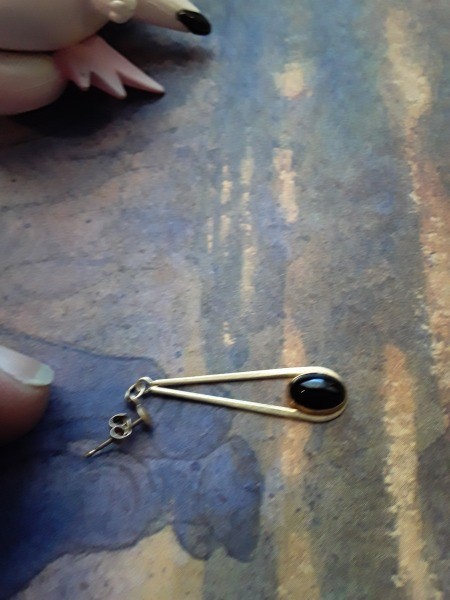 Identifying a Jewelry Maker's Mark - silver teardrop shaped earring with a dark blue stone at the bottom