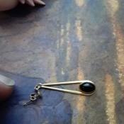 Identifying a Jewelry Maker's Mark - silver teardrop shaped earring with a dark blue stone at the bottom