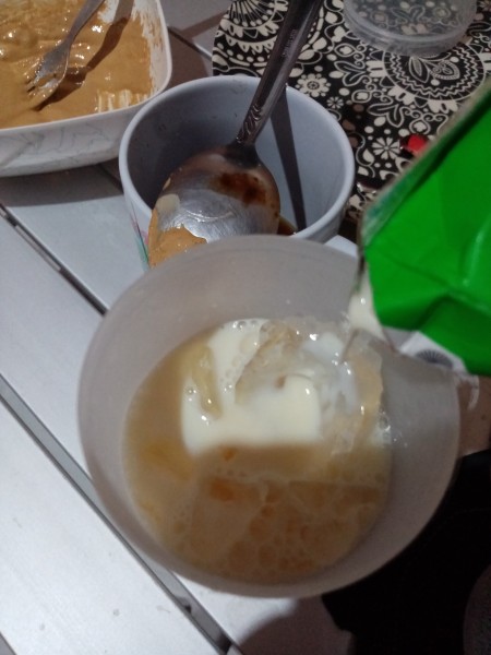 glass with ice, milk & coffee sugar mixture