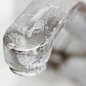 A faucet with white streaks.