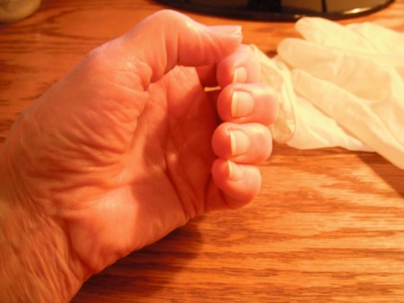 A hand moisturized by coconut oil.