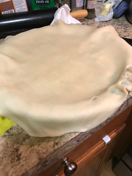 covering pie with dough